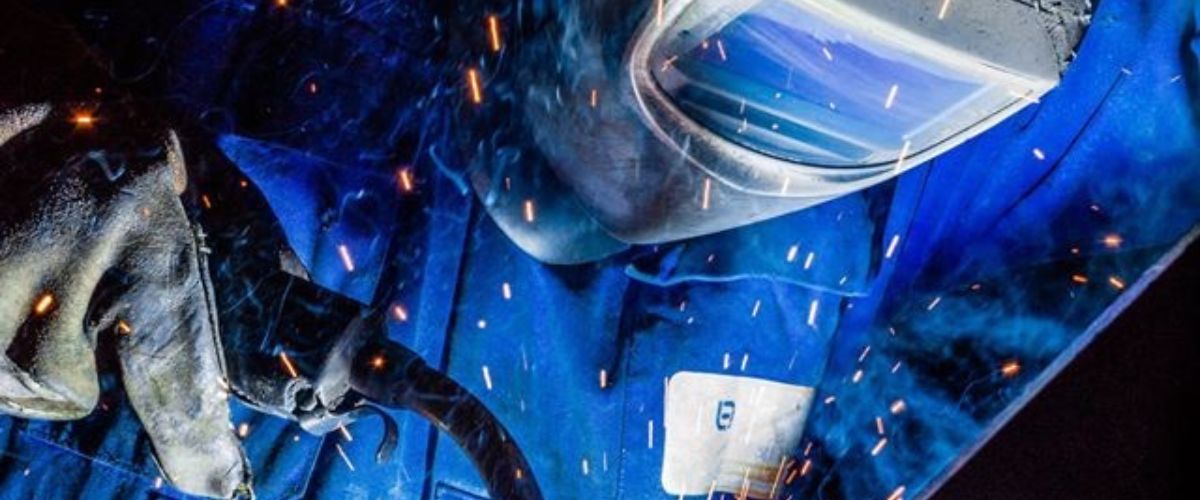 a person welding some metal